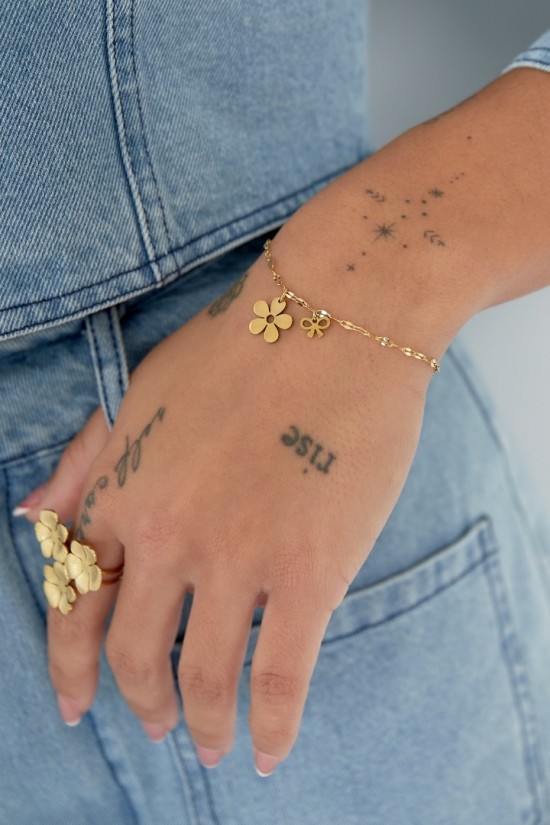 Armband bloem en strik goud